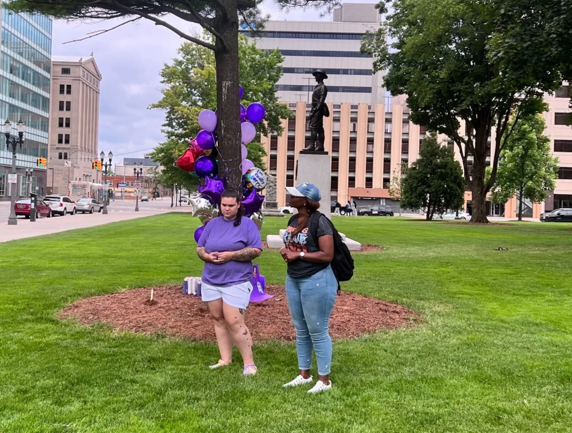 Mackenzie Winston and Shanell Henry lead attendants in a moment of silence in honor of Wynter Cole-Smith.